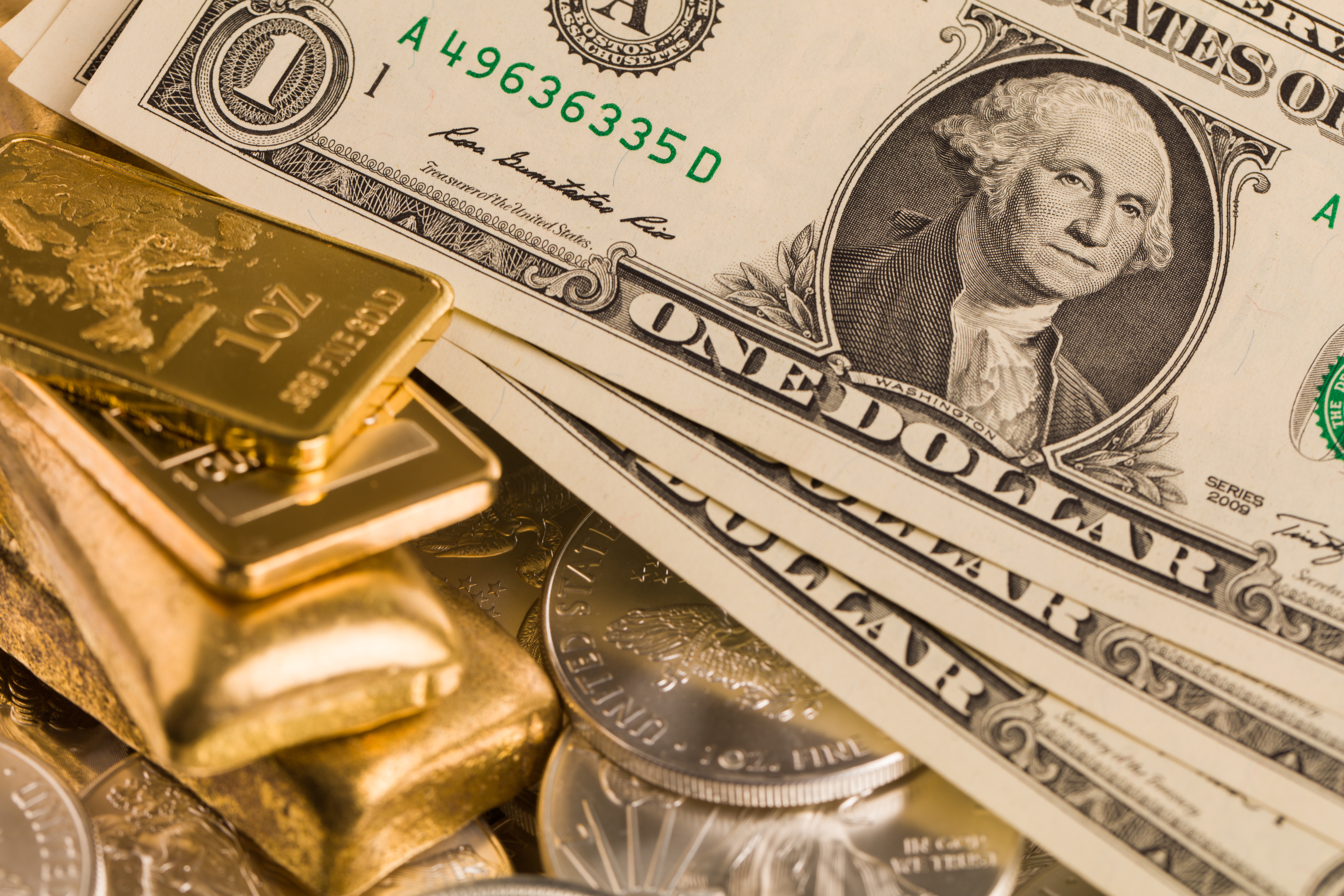 silver and gold bullion on the table